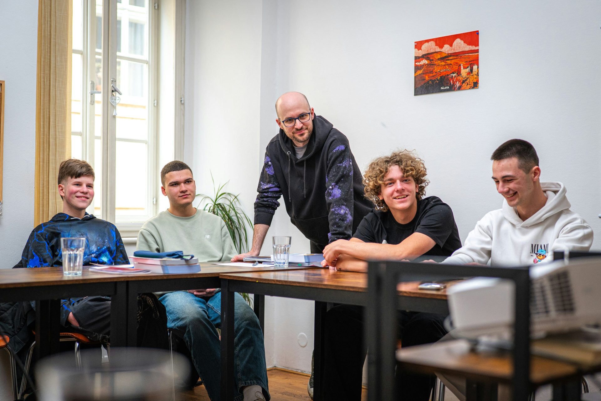 A group of young men gathered around a table